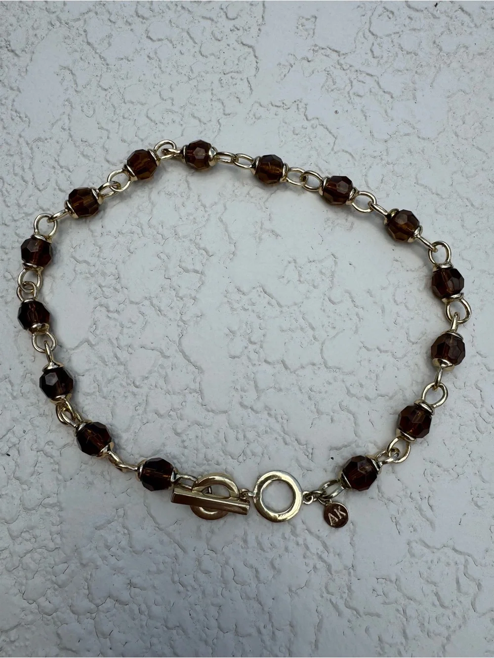 Anne Klein smoky topaz and gold toggle necklace